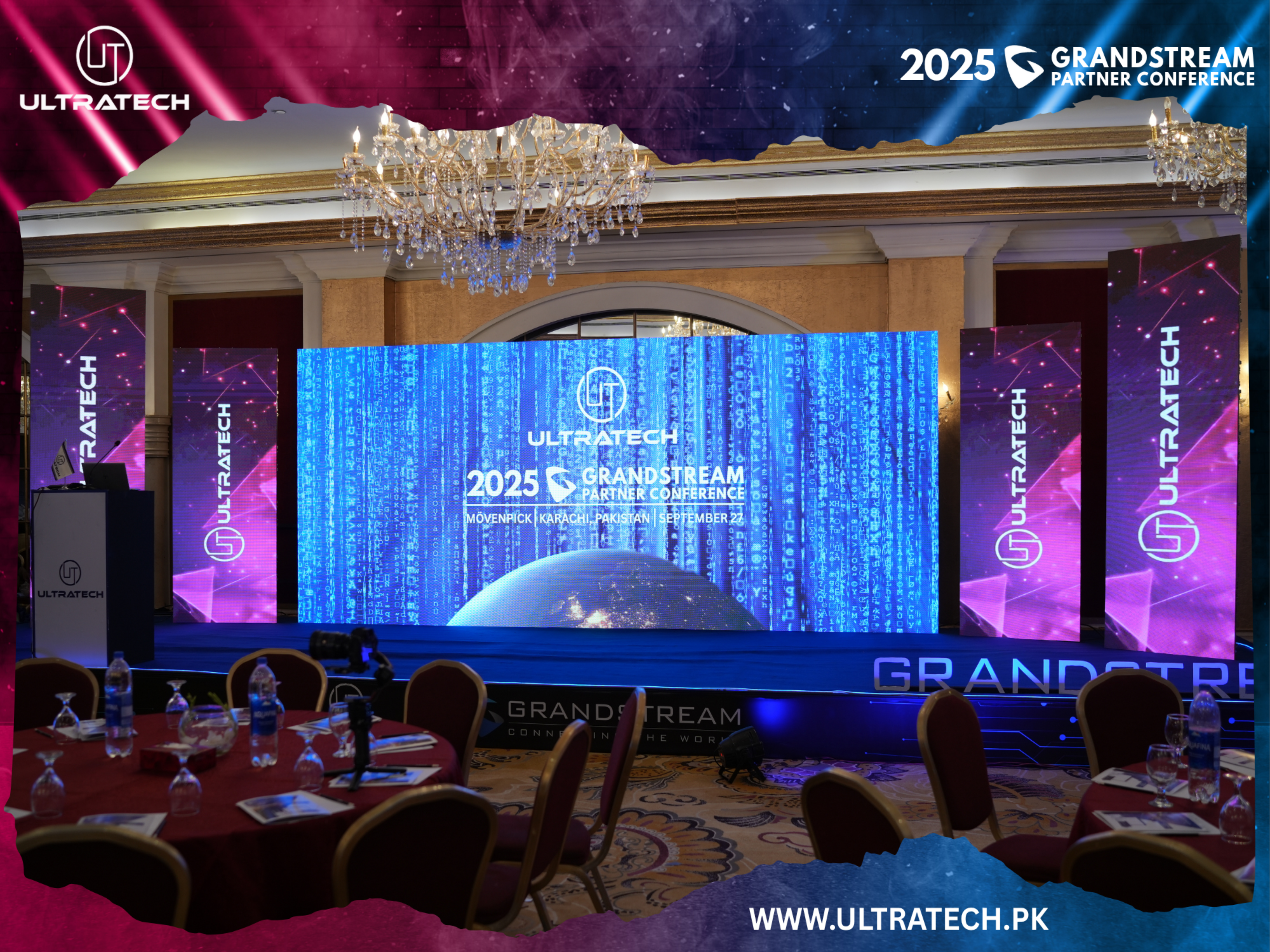 Grand event setup with UltraTech and Grandstream branding, featuring a large screen and chandelier.
