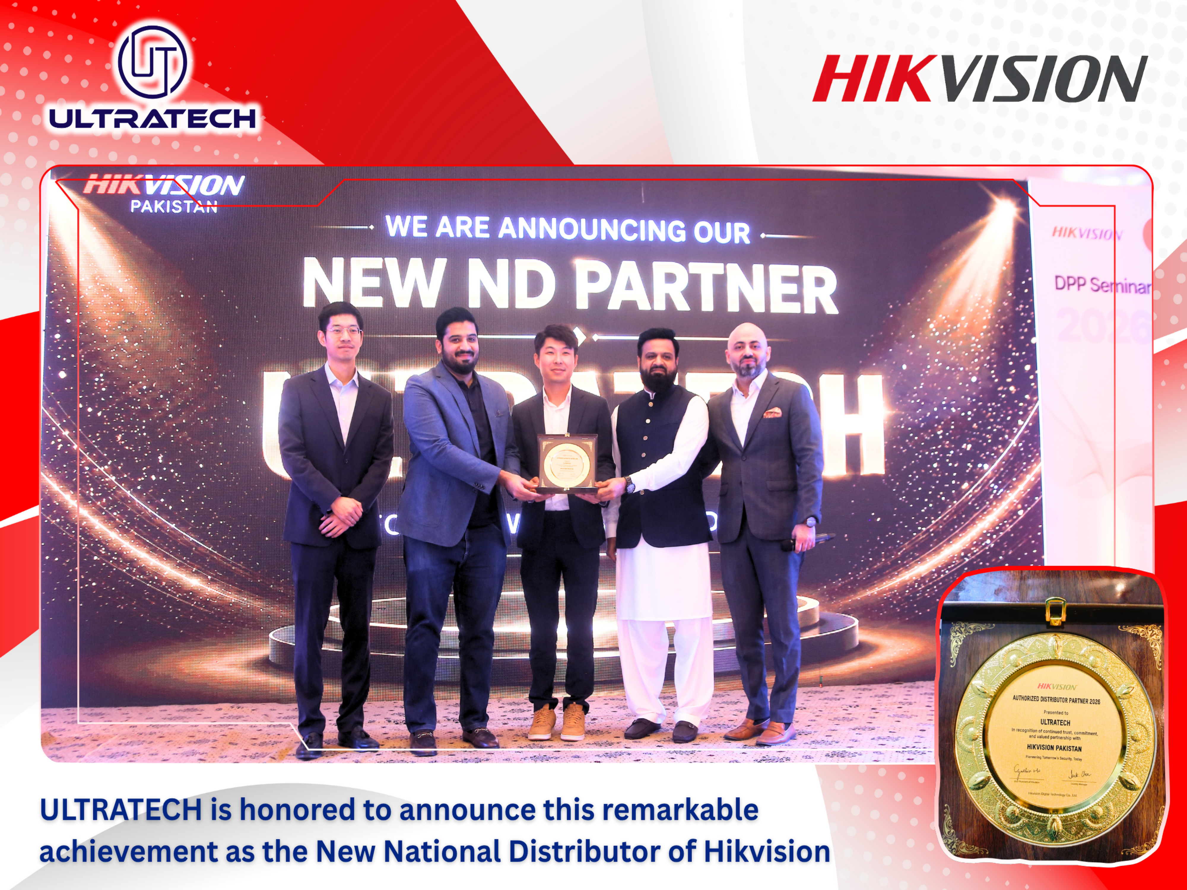 Group of people holding an award with Ultratech and Hikvision logos on a red and white background.